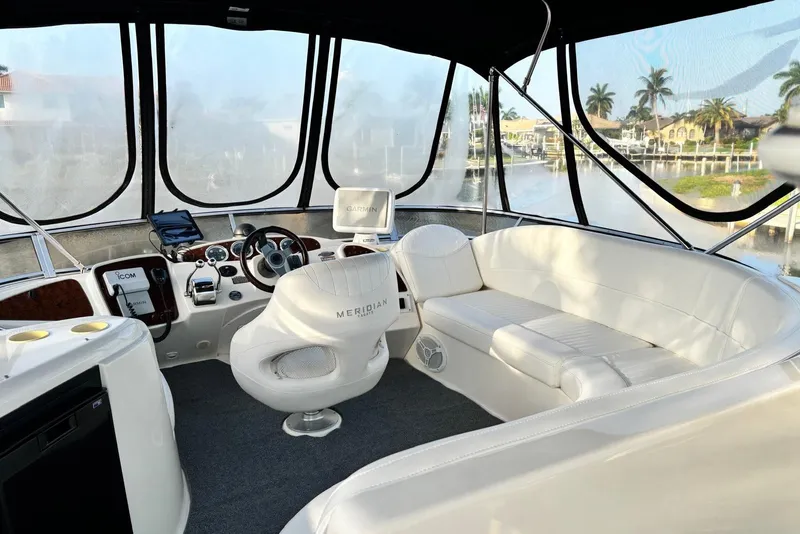 Slide: The Image of Luxurious 2004 Meridian 459 Motoryacht interior with plush seating and modern navigation equipment. - 16