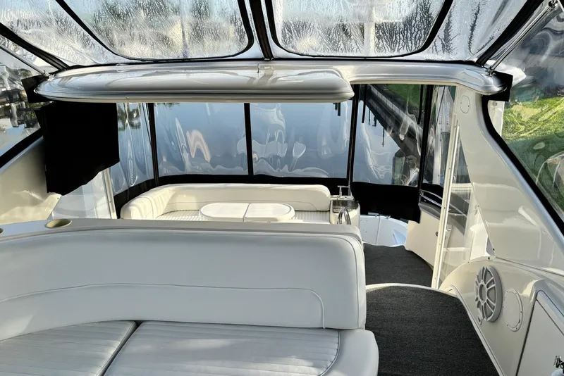 Slide: The Image of Luxurious interior of 2004 Meridian 459 Motoryacht with white seating and panoramic windows. - 11