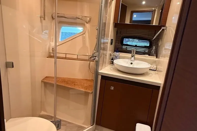 Slide: The Image of Luxurious bathroom in 2016 Sea Ray Sundancer 510 yacht with modern fixtures and elegant design. - 26