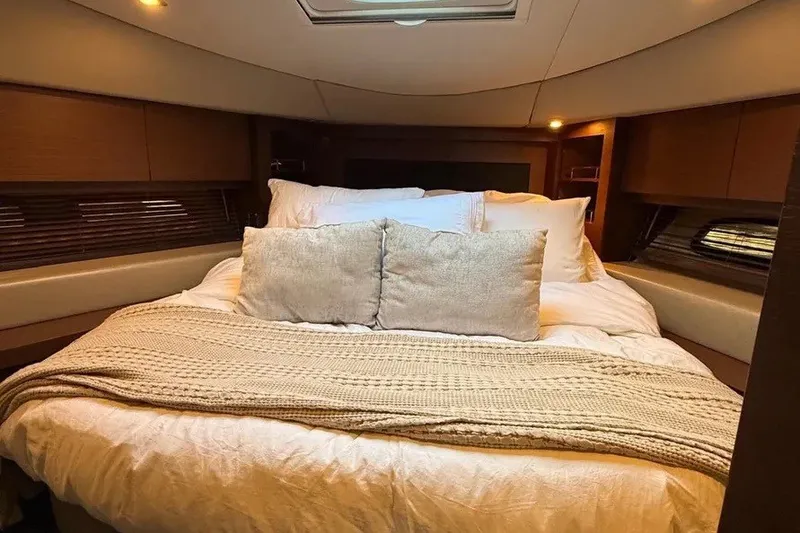 Slide: The Image of Luxurious bedroom interior of 2016 Sea Ray Sundancer 510 yacht with cozy bedding. - 23