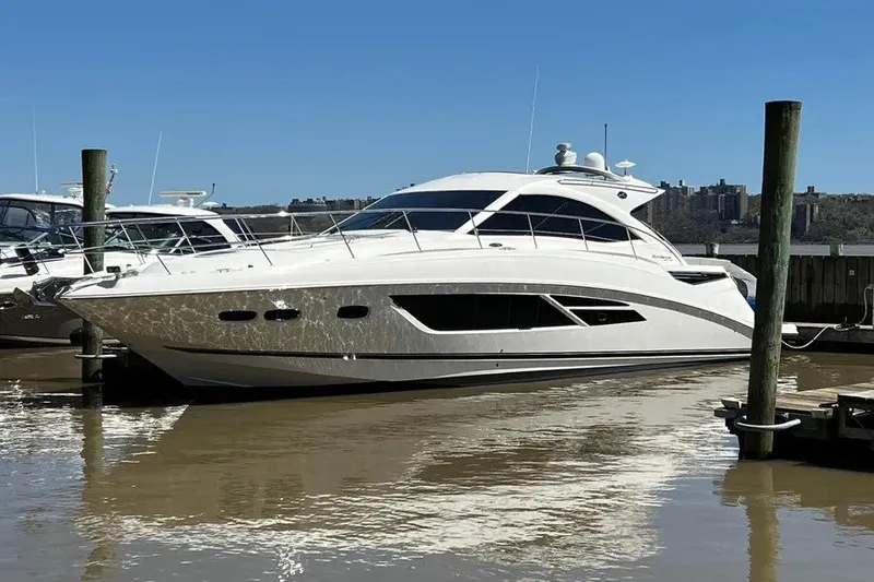 Slide: The Image of 2016 Sea Ray Sundancer 510 yacht docked in a marina under clear blue skies. - 4