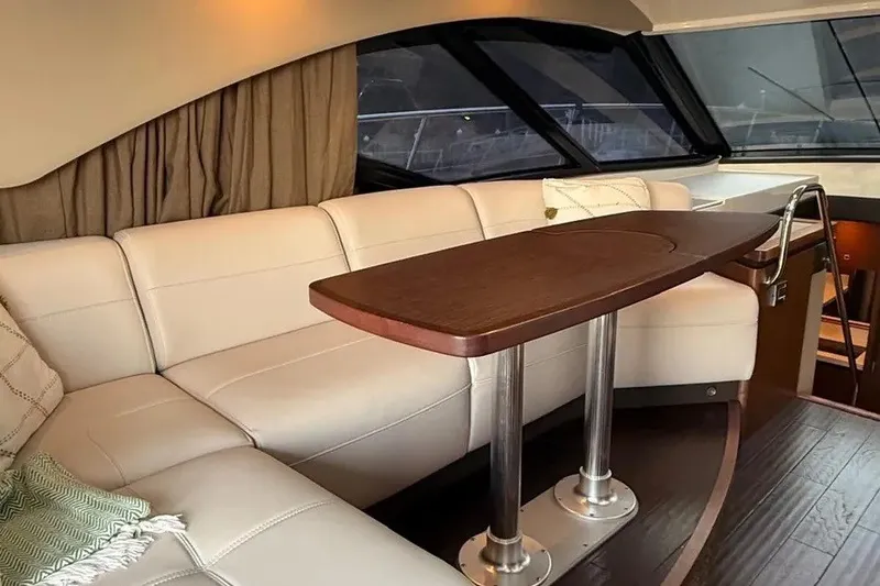 Slide: The Image of Luxurious interior of 2016 Sea Ray Sundancer 510 yacht with elegant seating and table. - 16
