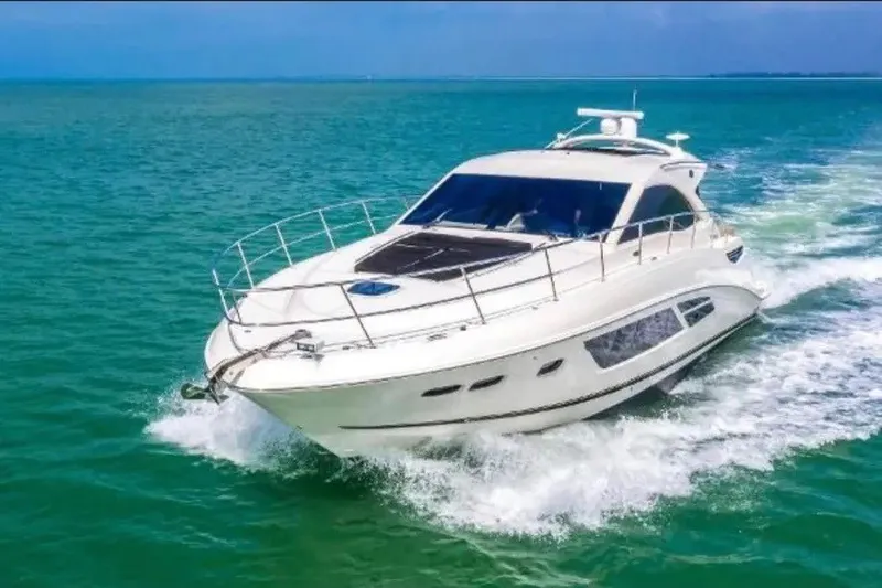 The Image of 2016 Sea Ray Sundancer 510 yacht cruising on turquoise waters. - 1