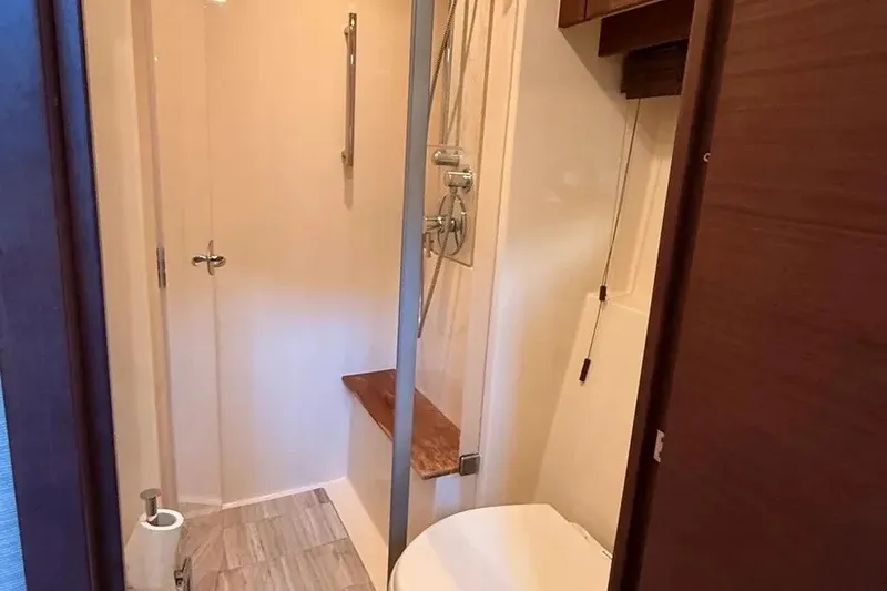 Slide: The Image of Bathroom interior of 2016 Sea Ray Sundancer 510 yacht with shower and toilet. - 25