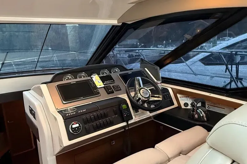 Slide: The Image of Helm of 2016 Sea Ray Sundancer 510 yacht with modern controls and navigation equipment. - 11