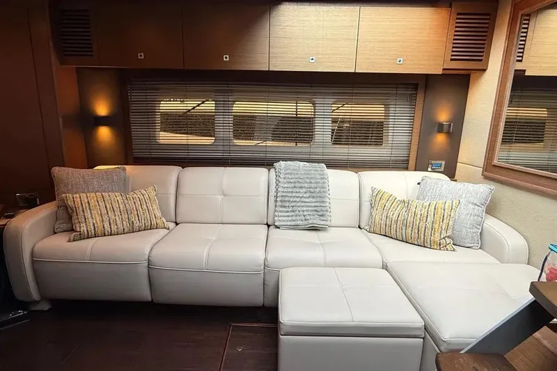 Slide: The Image of Luxurious interior of 2016 Sea Ray Sundancer 510 yacht with plush white sofa and cushions. - 18