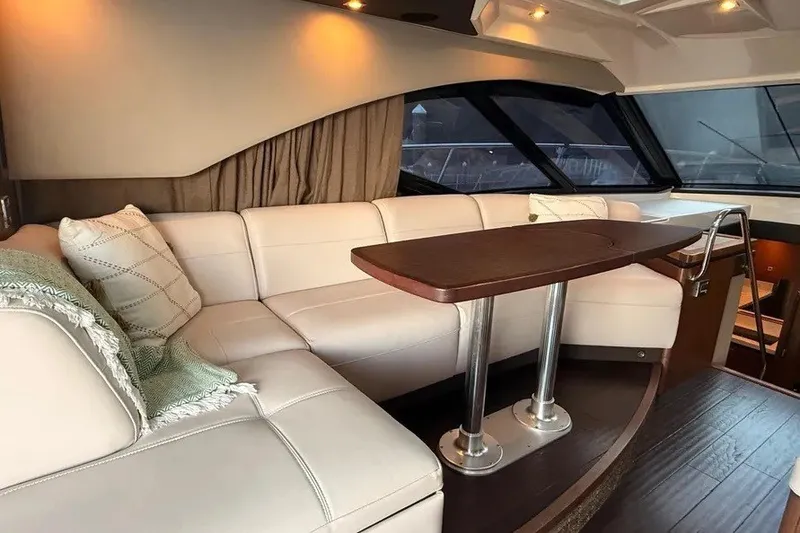 Slide: The Image of Luxurious interior of 2016 Sea Ray Sundancer 510 yacht with elegant seating and table. - 21