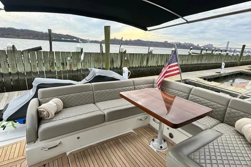Slide: The Image of Luxurious 2016 Sea Ray Sundancer 510 yacht interior with elegant seating and American flag. - 12