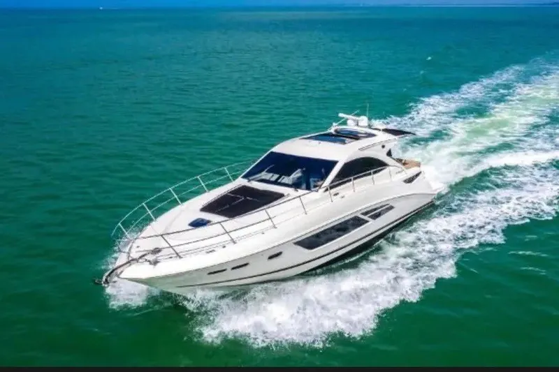 Slide: The Image of 2016 Sea Ray Sundancer 510 cruising on open water, showcasing sleek design and performance. - 1
