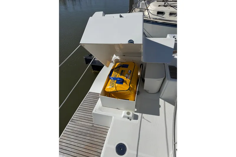 Slide: The Image of Beneteau Oceanis 370 (2013) deck storage with yellow safety equipment bag. - 18
