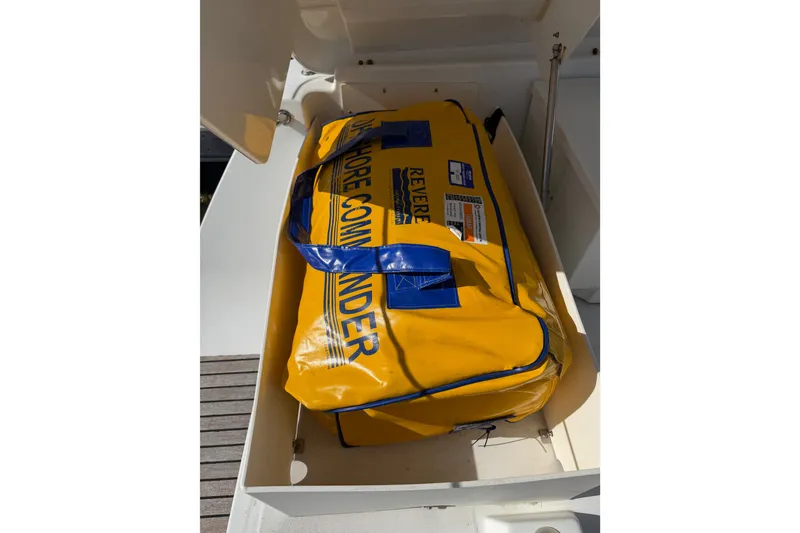 Slide: The Image of Yellow safety bag on Beneteau Oceanis 370, 2013 model, stored in a compartment. - 19