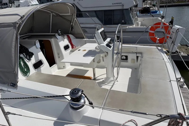 Slide: The Image of Beneteau Oceanis 370 sailboat cockpit, 2013 model, featuring steering wheel and navigation equipment. - 7