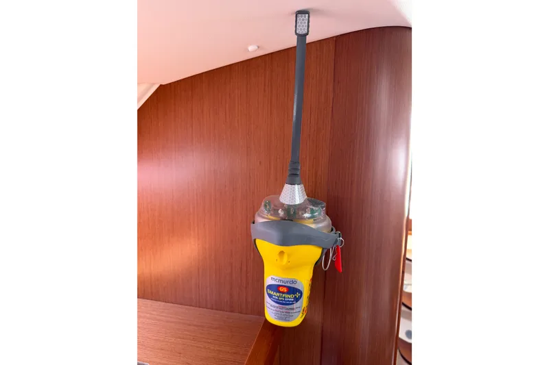 Slide: The Image of Emergency beacon mounted on a 2013 Beneteau Oceanis 370 yacht interior. - 26