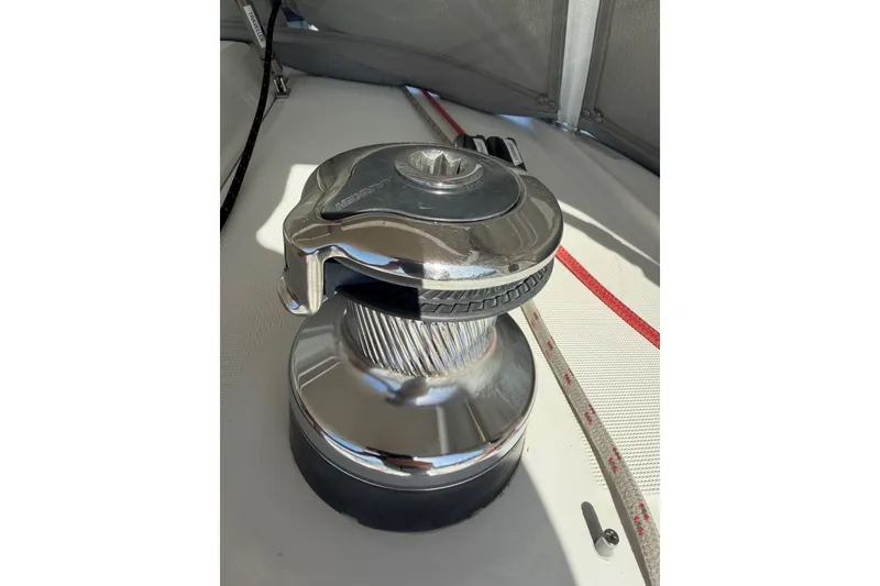 Slide: The Image of Winch on 2013 Beneteau Oceanis 370 sailboat deck, with ropes and fittings. - 21