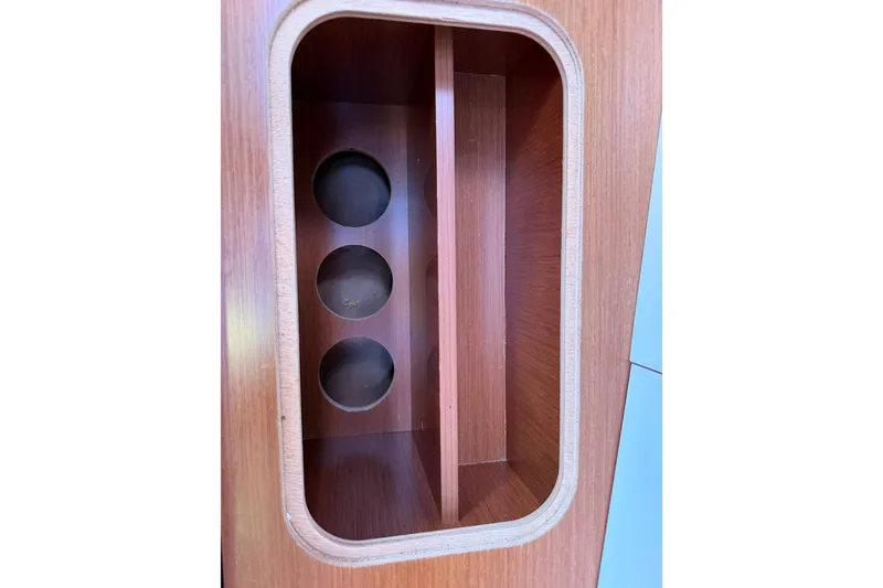 Slide: The Image of Wooden storage compartment on a 2013 Beneteau Oceanis 370 sailboat interior. - 34