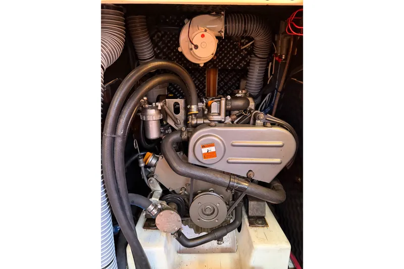 Slide: The Image of Engine compartment of a 2013 Beneteau Oceanis 370 sailboat, showcasing mechanical components. - 37