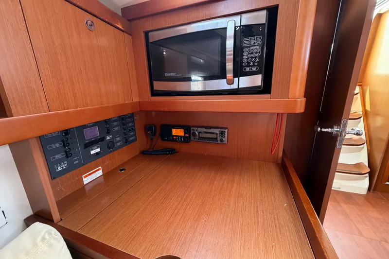 Slide: The Image of Interior of 2013 Beneteau Oceanis 370 yacht with microwave and control panel. - 33