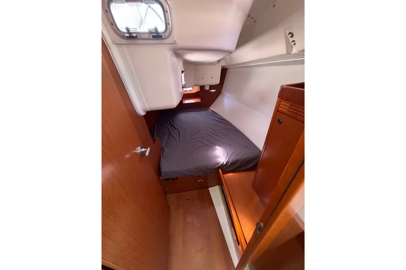 Slide: The Image of Cozy cabin interior of 2013 Beneteau Oceanis 370 sailboat with wooden furnishings. - 16
