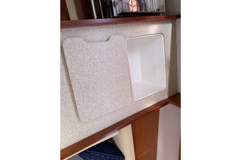 Slide: The Image of Beneteau Oceanis 370 (2013) interior sink with countertop in yacht galley. - 32