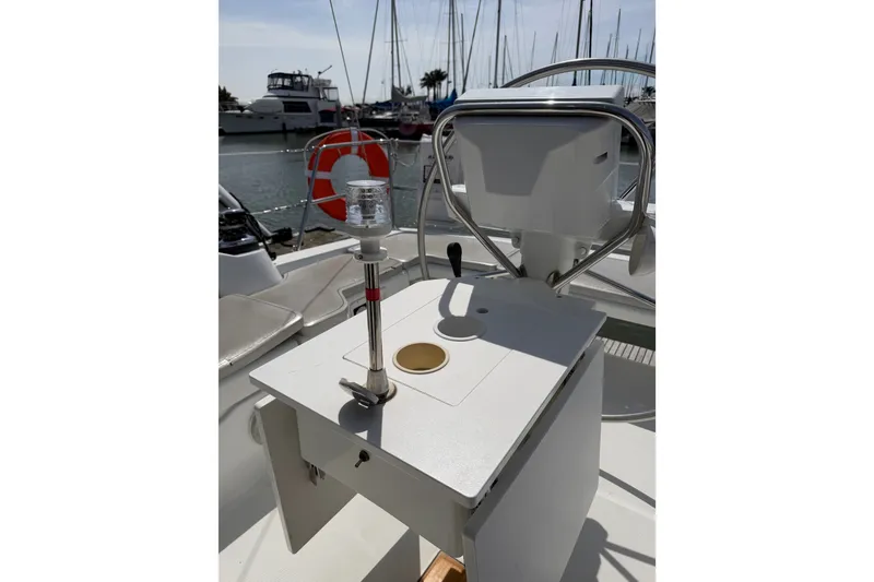 Slide: The Image of Cockpit of 2013 Beneteau Oceanis 370 sailboat with steering wheel and navigation equipment. - 9