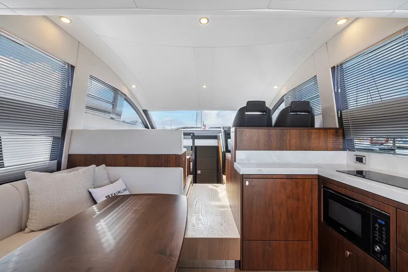 Slide: The Image of Luxurious interior of 2025 Fairline Squadron 50 yacht with modern furnishings and sleek design. - 62