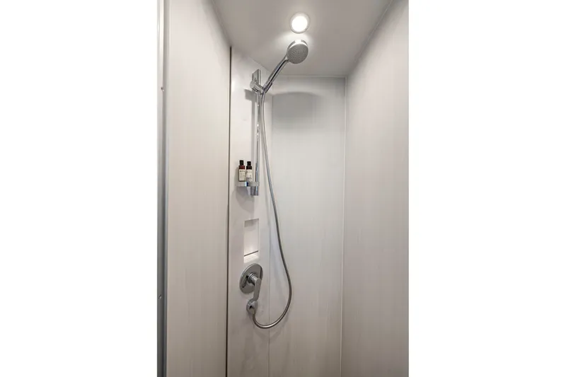 Slide: The Image of Shower area in 2025 Fairline Squadron 50 yacht, featuring modern fixtures and lighting. - 35