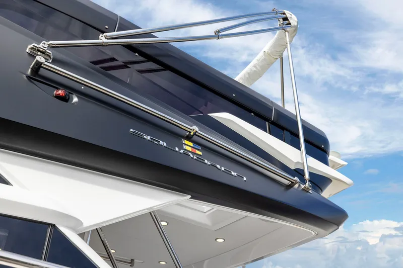Slide: The Image of 2025 Fairline Squadron 50 yacht exterior against a blue sky. - 81