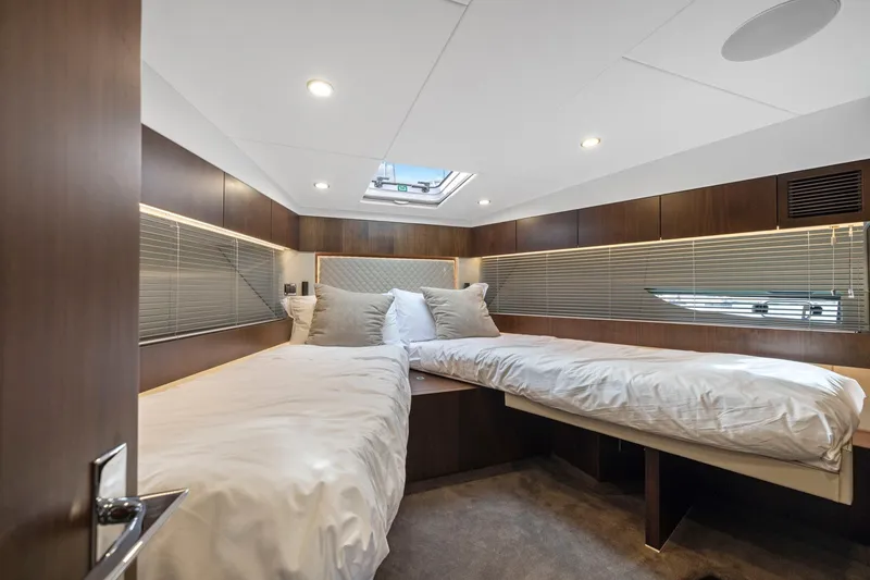 Slide: The Image of Luxurious cabin interior of 2025 Fairline Squadron 50 yacht with twin beds and modern design. - 68
