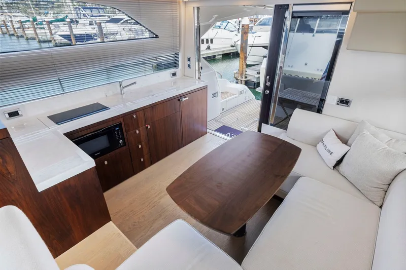 Slide: The Image of Luxurious interior of 2025 Fairline Squadron 50 yacht with modern kitchen and seating area. - 60