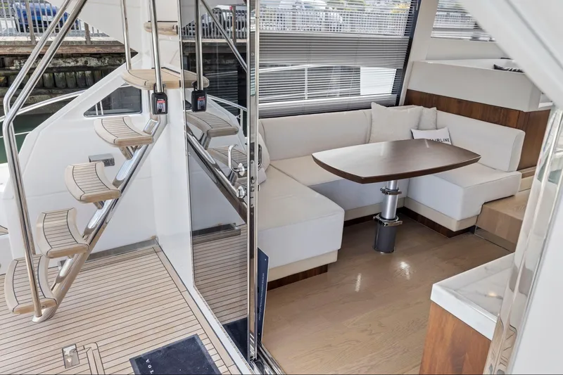 Slide: The Image of Luxurious interior of 2025 Fairline Squadron 50 yacht with elegant seating and modern design. - 85