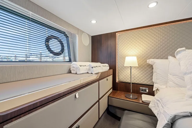 Slide: The Image of Luxurious cabin interior of 2025 Fairline Squadron 50 yacht with elegant bedding and lighting. - 77