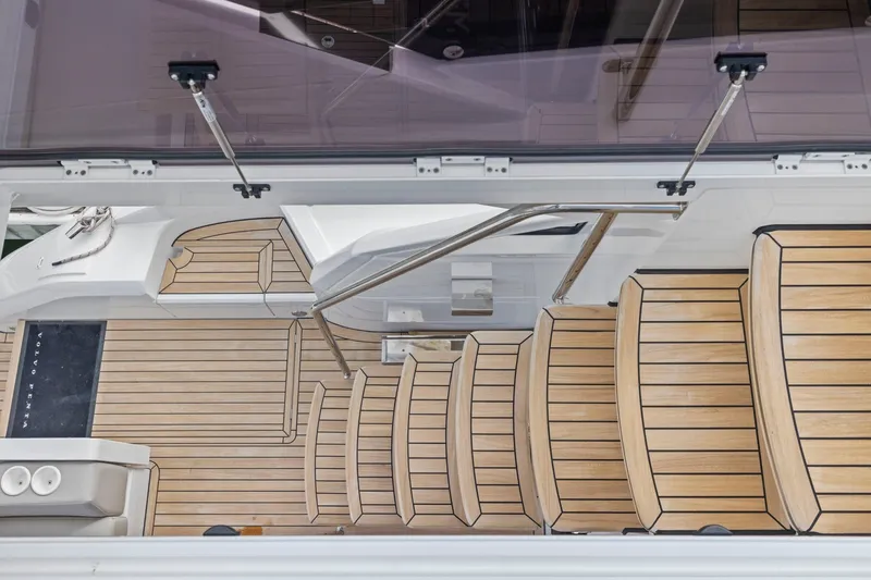 Slide: The Image of Staircase on 2025 Fairline Squadron 50 yacht with sleek wooden design. - 52