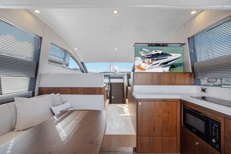 Slide: The Image of Luxurious interior of 2025 Fairline Squadron 50 yacht with modern amenities and elegant design. - 61