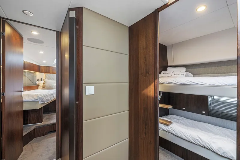 Slide: The Image of Luxurious interior of 2025 Fairline Squadron 50 yacht with cozy bunk beds and elegant design. - 65