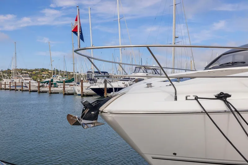 Slide: The Image of 2025 Fairline Squadron 50 yacht docked in a marina, showcasing sleek design and luxury. - 80