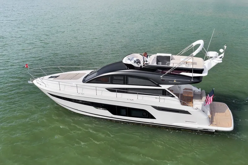 Slide: The Image of 2025 Fairline Squadron 50 yacht cruising on open water, showcasing sleek design and luxury features. - 45