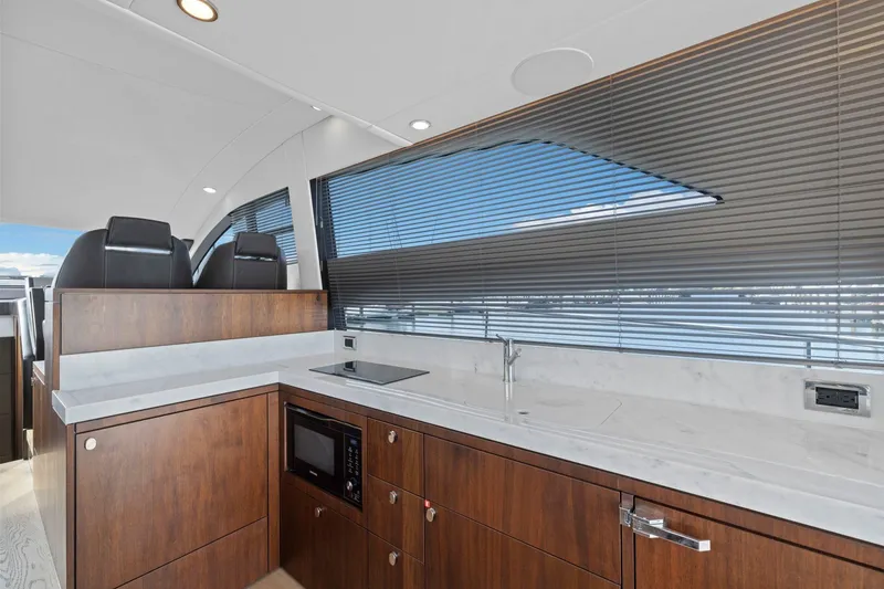 Slide: The Image of Modern kitchen interior of 2025 Fairline Squadron 50 yacht with sleek wood cabinetry. - 55