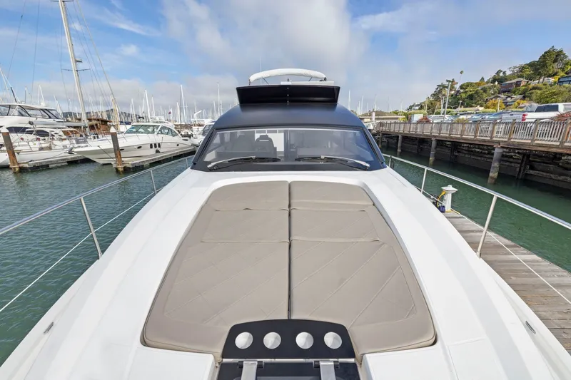 Slide: The Image of 2025 Fairline Squadron 50 yacht docked at marina, showcasing sleek design and spacious deck. - 88