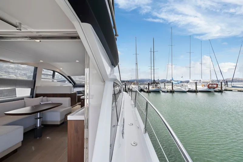 Slide: The Image of 2025 Fairline Squadron 50 yacht interior and marina view, showcasing luxury and elegance. - 84
