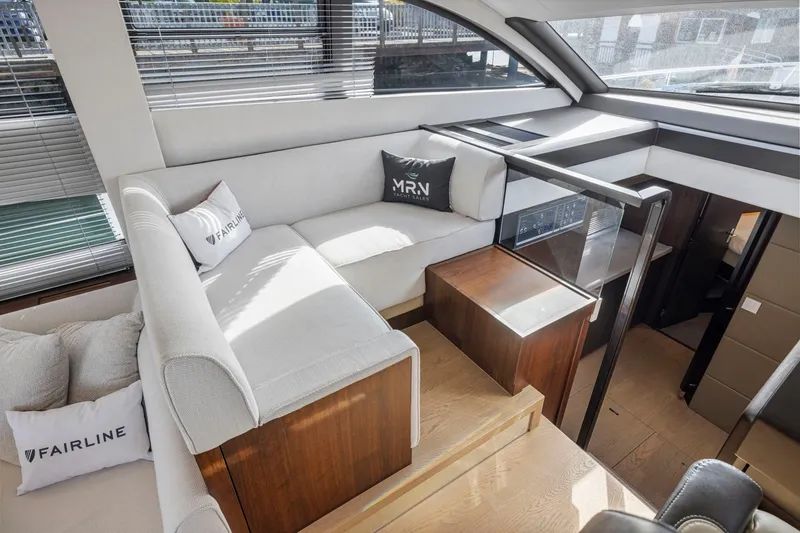 Slide: The Image of Luxurious interior of 2025 Fairline Squadron 50 yacht with modern seating and elegant design. - 59