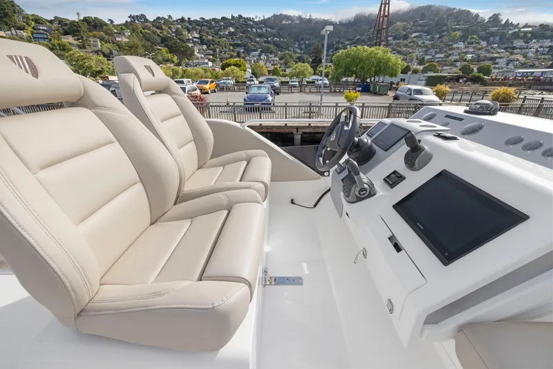Slide: The Image of 2025 Fairline Squadron 50 yacht cockpit with luxurious seating and advanced navigation controls. - 94