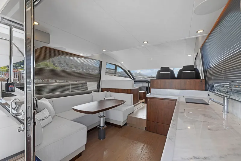 Slide: The Image of Luxurious interior of 2025 Fairline Squadron 50 yacht with modern seating and sleek design. - 54