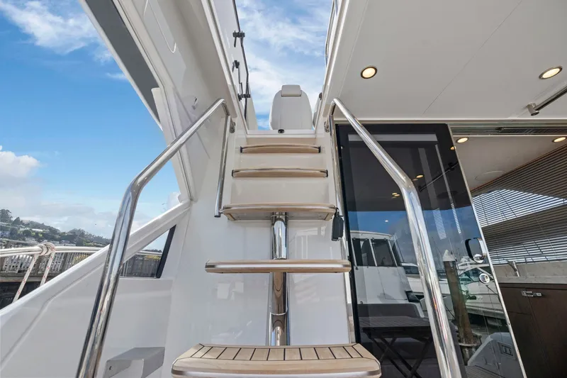 Slide: The Image of Staircase on 2025 Fairline Squadron 50 yacht, featuring sleek design and modern finishes. - 92