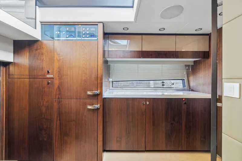 Slide: The Image of Luxurious interior of 2025 Fairline Squadron 50 yacht with sleek wood cabinetry and modern design. - 64