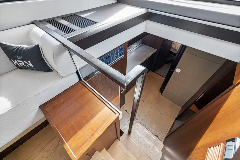 Slide: The Image of Interior view of 2025 Fairline Squadron 50 yacht, featuring modern design and wooden finishes. - 63