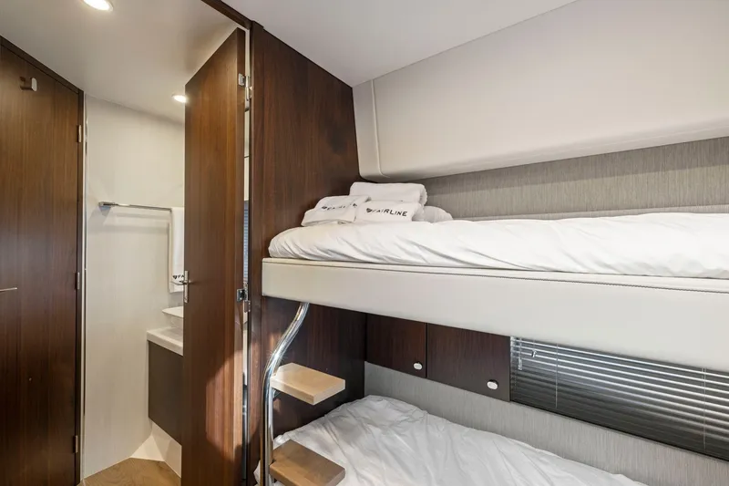 Slide: The Image of Interior of 2025 Fairline Squadron 50 yacht with bunk beds and modern design. - 66