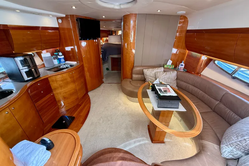 Slide: The Image of Luxurious interior of a 2006 Azimut Atlantis 47 yacht with elegant wood finishes. - 20