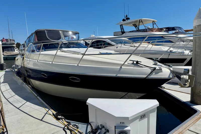 Slide: The Image of 2006 Azimut Atlantis 47 yacht docked at marina under clear blue sky. - 3