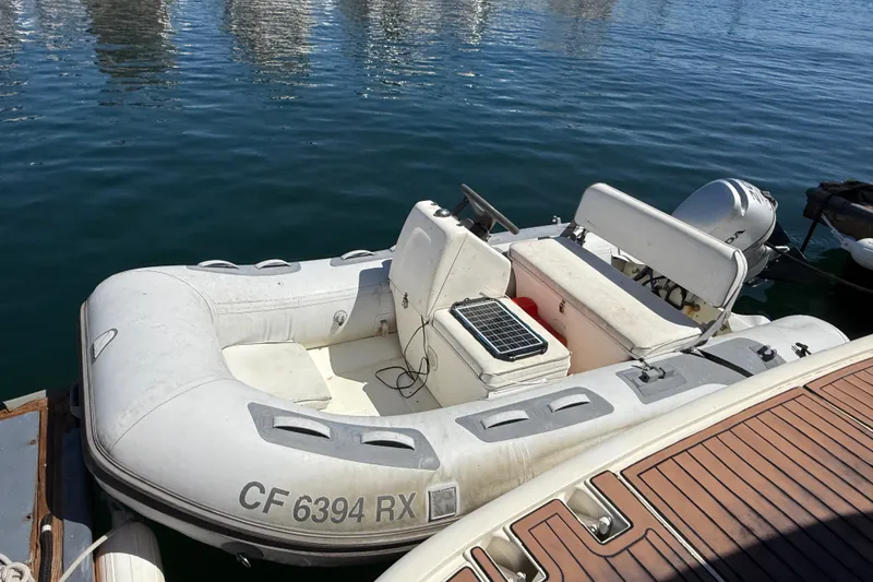 Slide: The Image of Inflatable boat docked beside Azimut Atlantis 47 yacht, 2006 model, with solar panel onboard. - 7