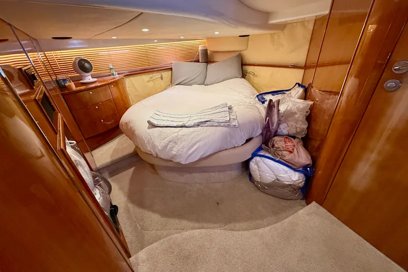 Slide: The Image of Luxurious cabin interior of 2006 Azimut Atlantis 47 yacht with cozy bed and wooden furnishings. - 29